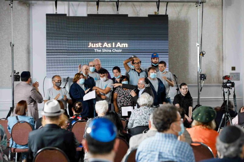 The Shira Choir on stage singing